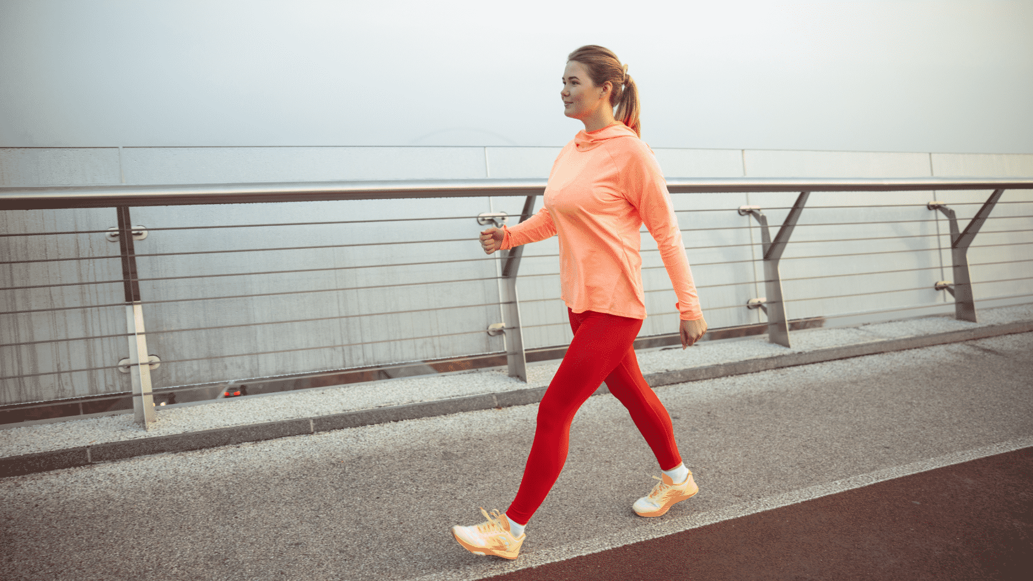 woman walking in bright fitness clothes