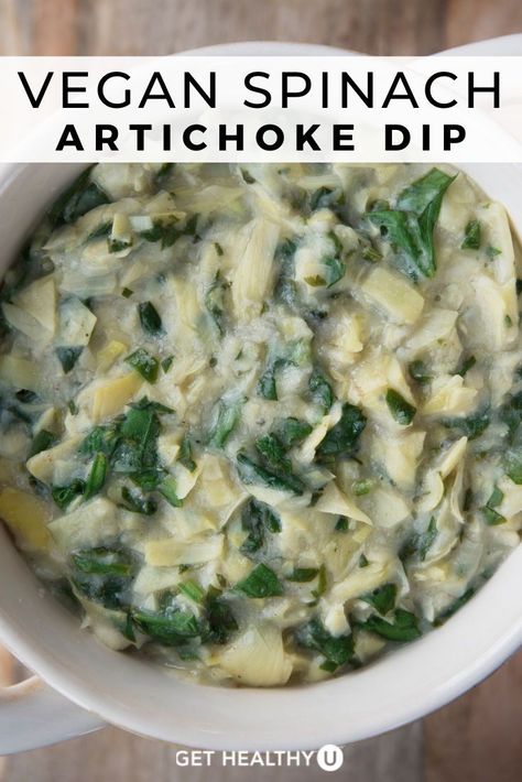 A white bowl of healthy vegan spinach artichoke dip