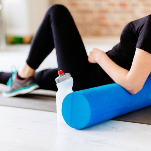 woman showing benefits of foam rolling