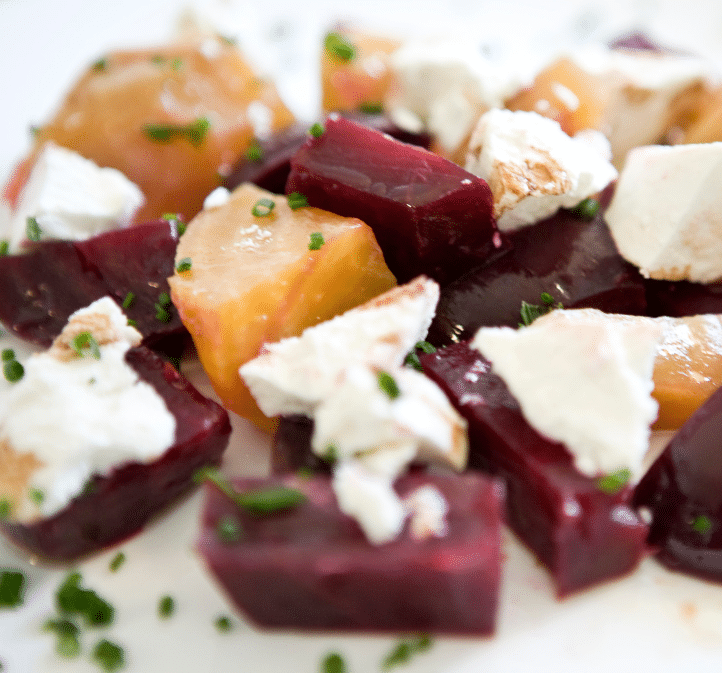 Red and golden beets topped with goat cheese