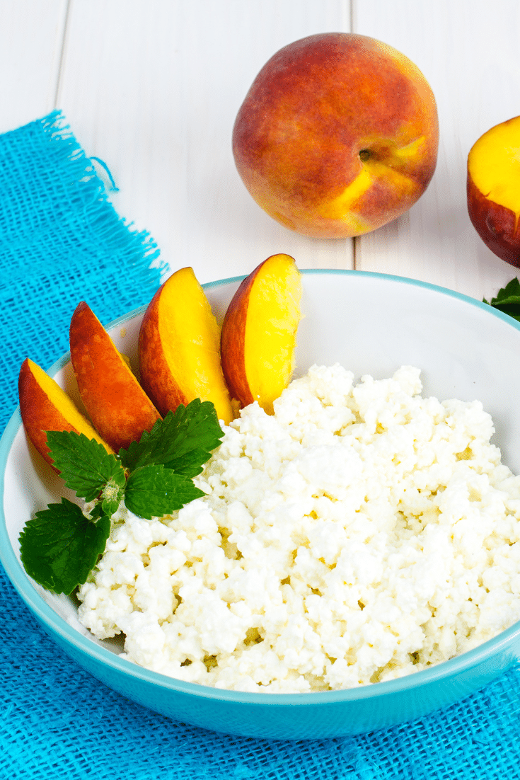 Cottage cheese in a bowl with sliced nectarines