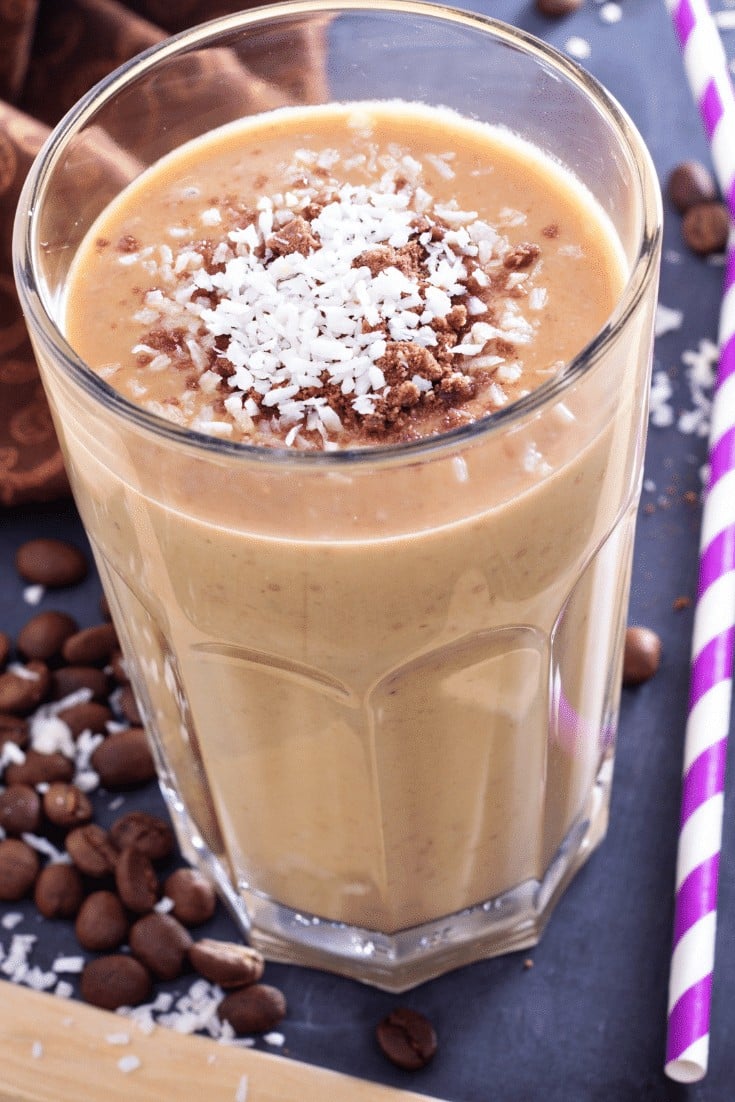 Chocolate coffee smoothie in a glass with a purple straw