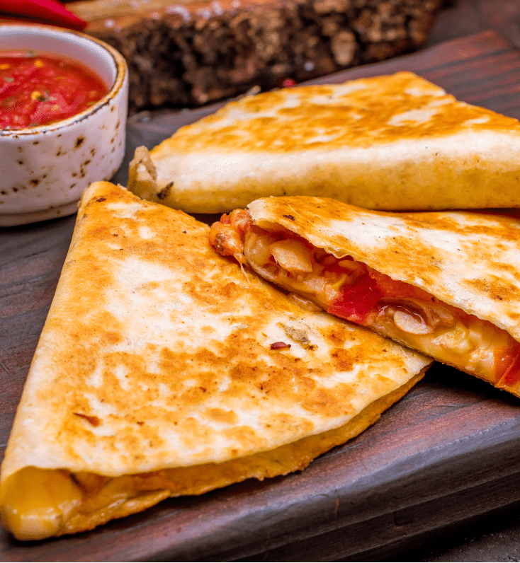 Cheese quesadilla slices with salsa