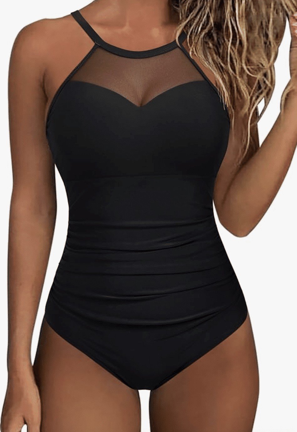 Picture of a woman wearing a black one piece swim suit with mesh at the top. 