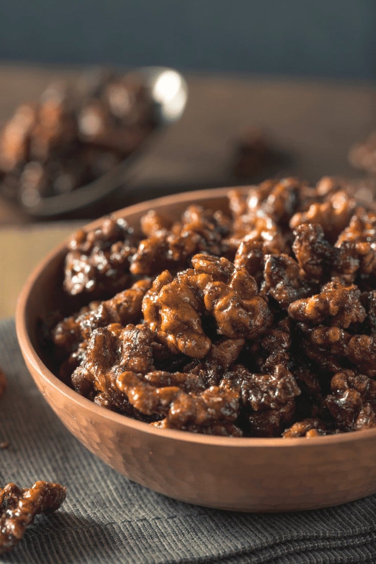 Wood bowl filled with spiced walnuts