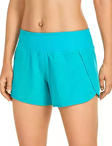 CRZ YOGA Womens Lightweight Gym Athletic Workout Shorts Liner 4" - Quick Dry Running Sport Spandex Shorts Mesh Zipper Pockets Holiday Blue Small