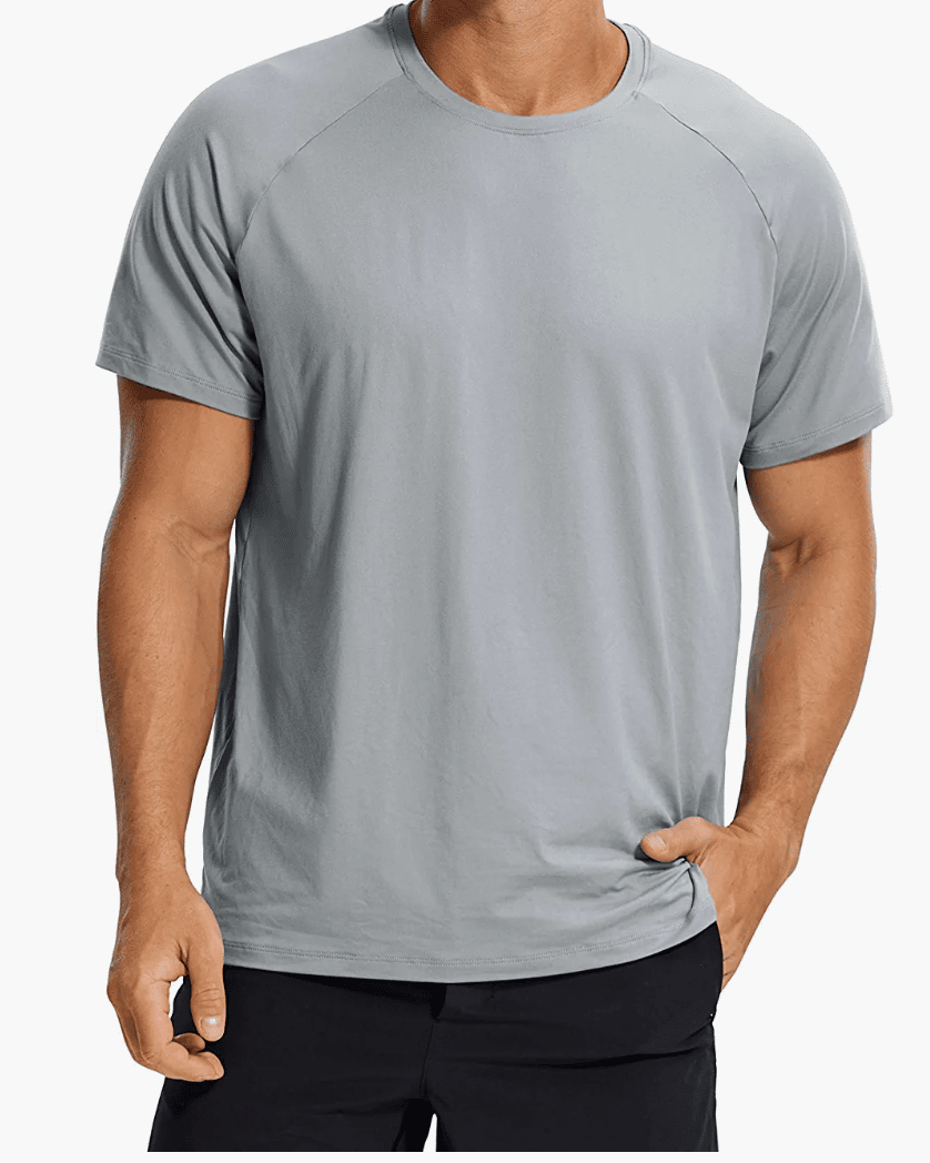 Man modeling a grey athletic t-shirt.