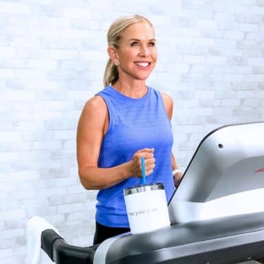 woman walking on treadmill for walking challenge