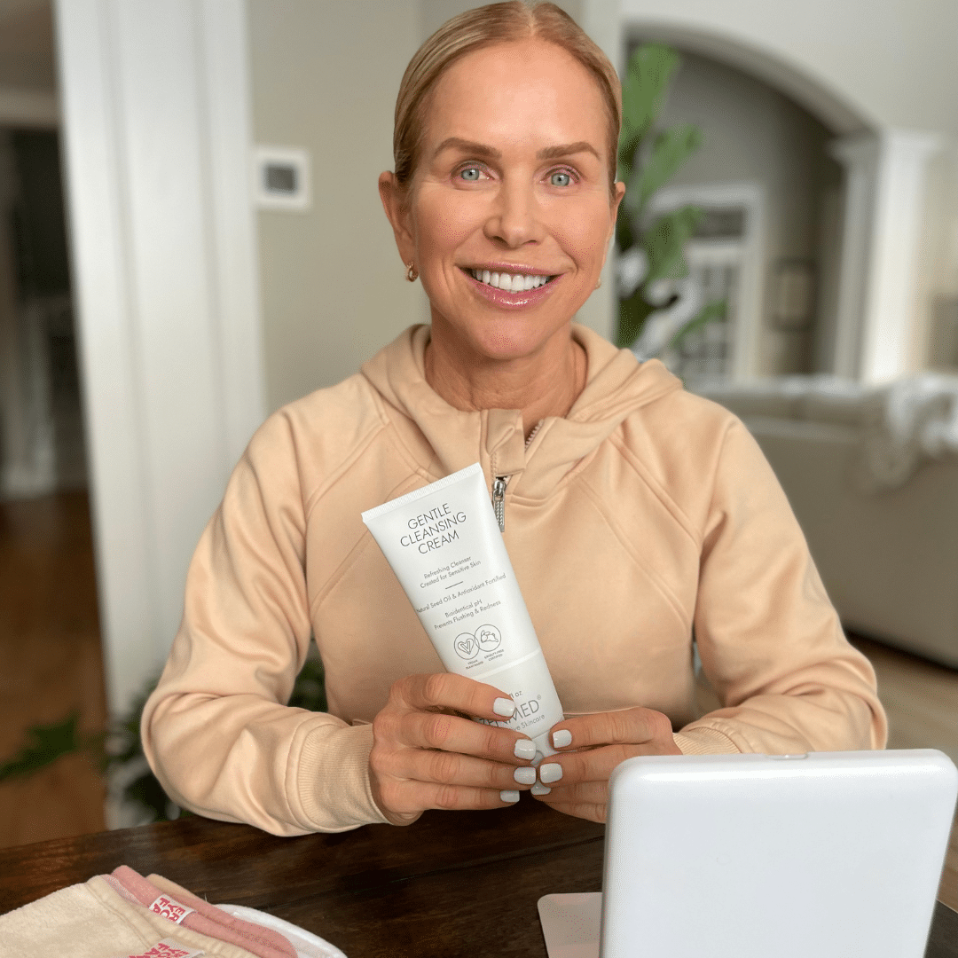 Chris Freytag holding zenmed gentle cleansing cream as her first pick for the best skin care for women over 50