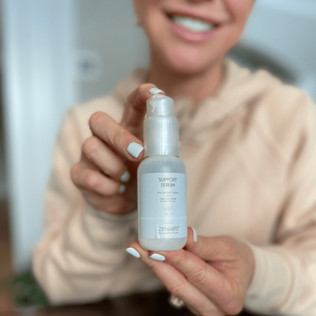 Chris Freytag holding a best skin care product for women over 50: the support serum zenmed product.