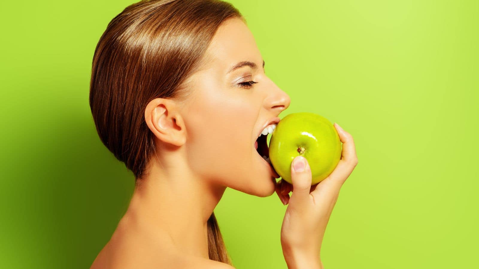 woman chewing apple