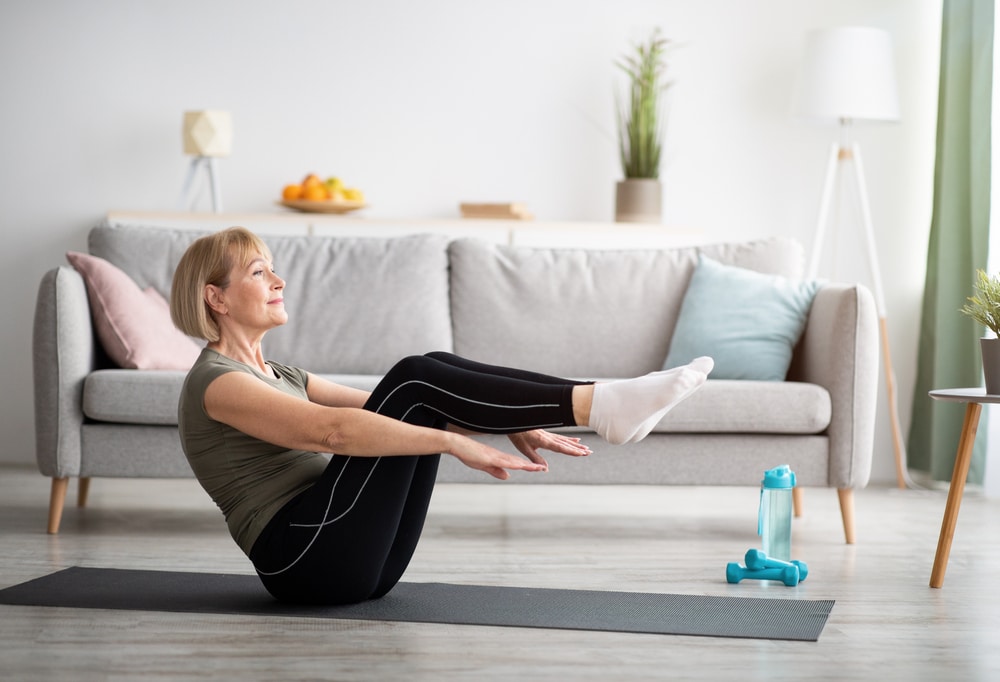 woman working out in living room