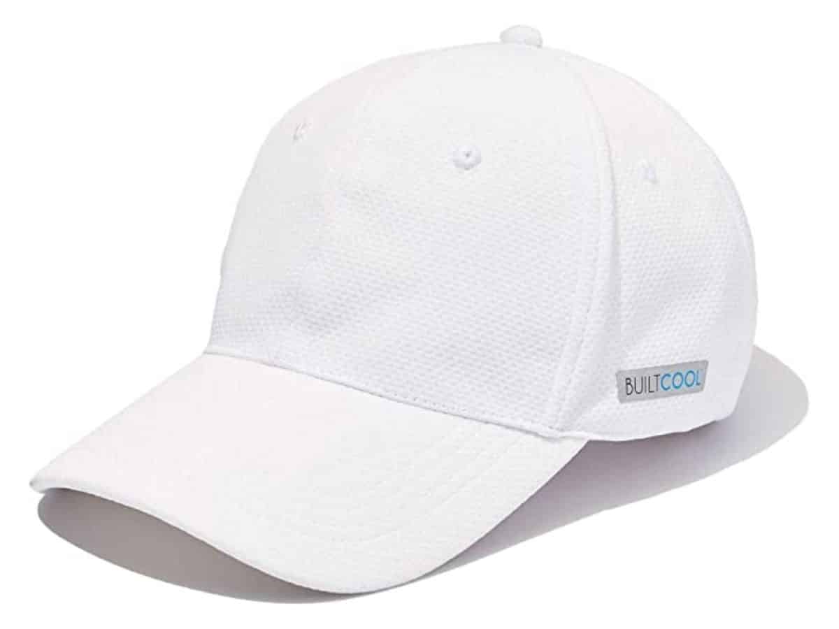 A white BUILTCOOL cooling baseball hat.