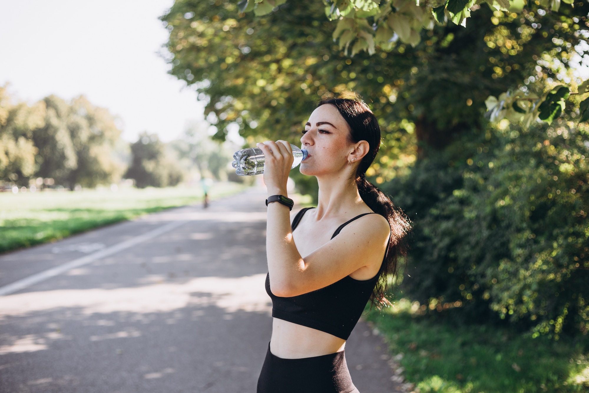 Fitness woman taking a break after running