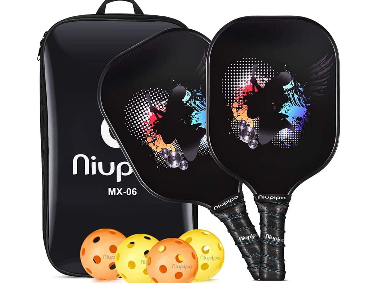 A set of two black Niupipo pickleball paddles in front of four pickleballs and a carrying case.