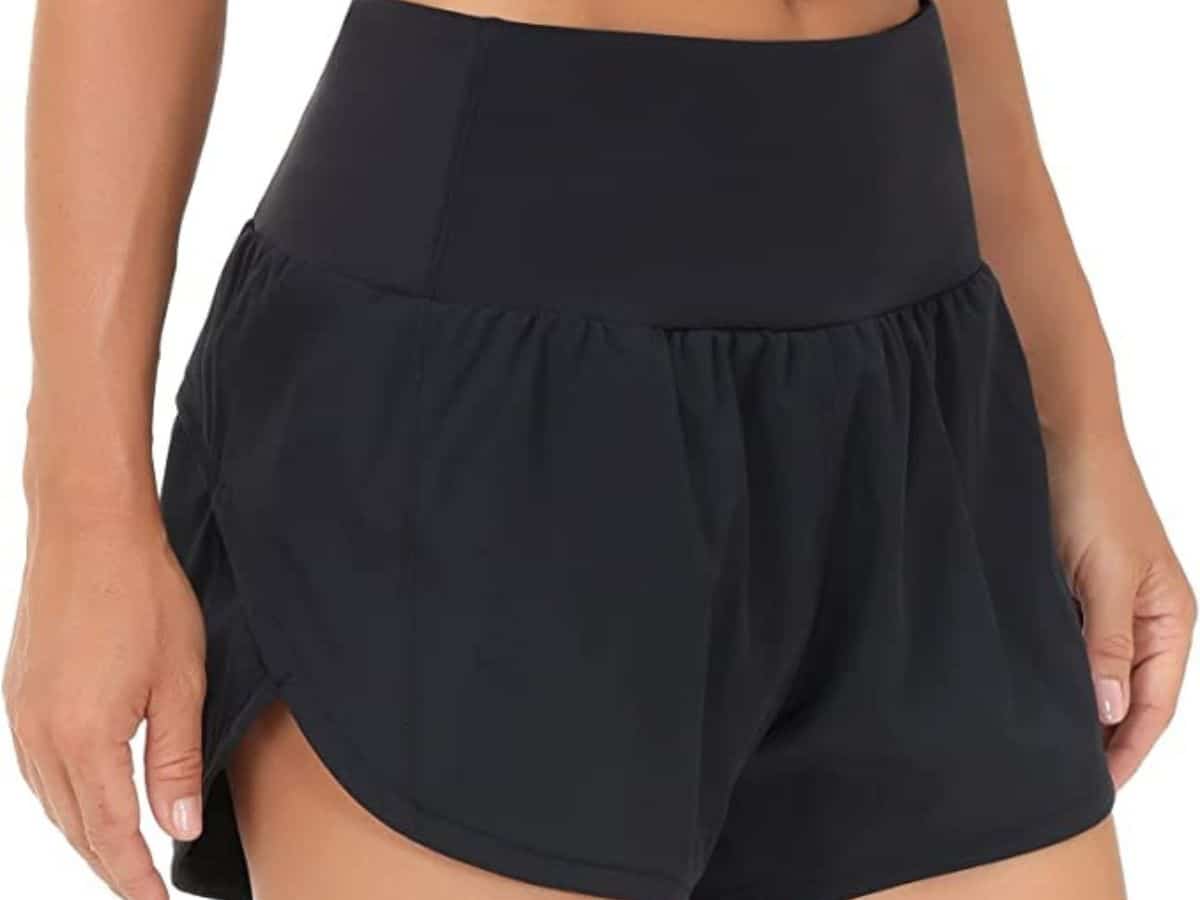 A person wearing a pair of black The Gym People high-waisted shorts.