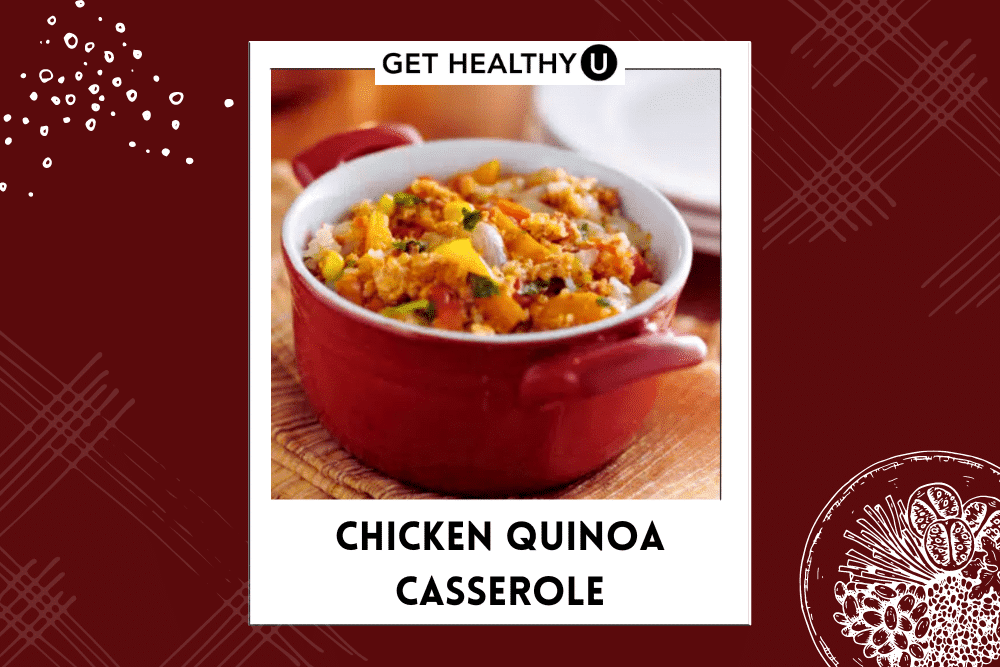 A red casserole dish filled with the chicken quinoa casserole, onions, and peppers.