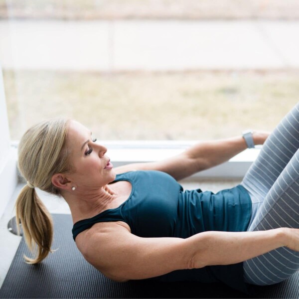 woman doing lower ab workout exercises