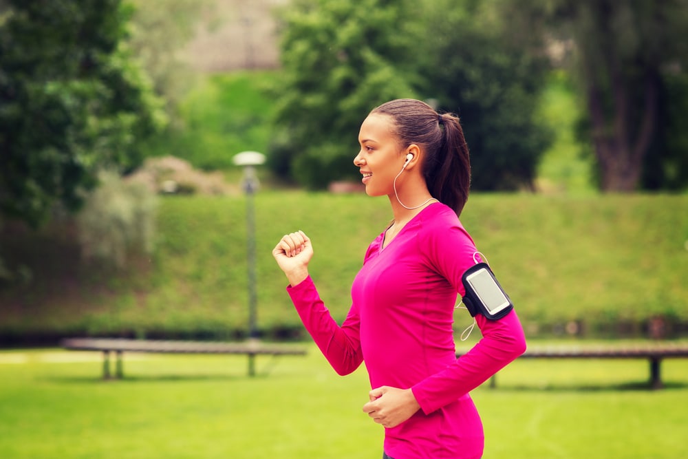 Woman powerfulness  walking successful  a pinkish  leap  suit.