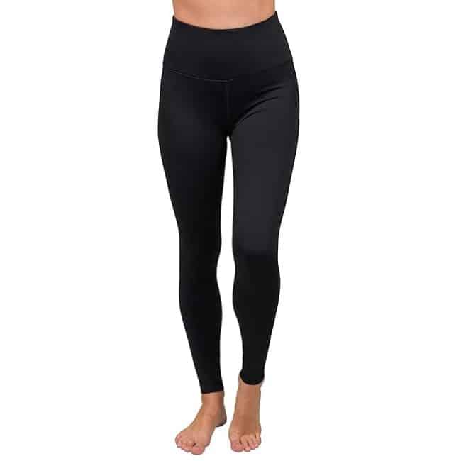 lower half of woman wearing black thermal leggings