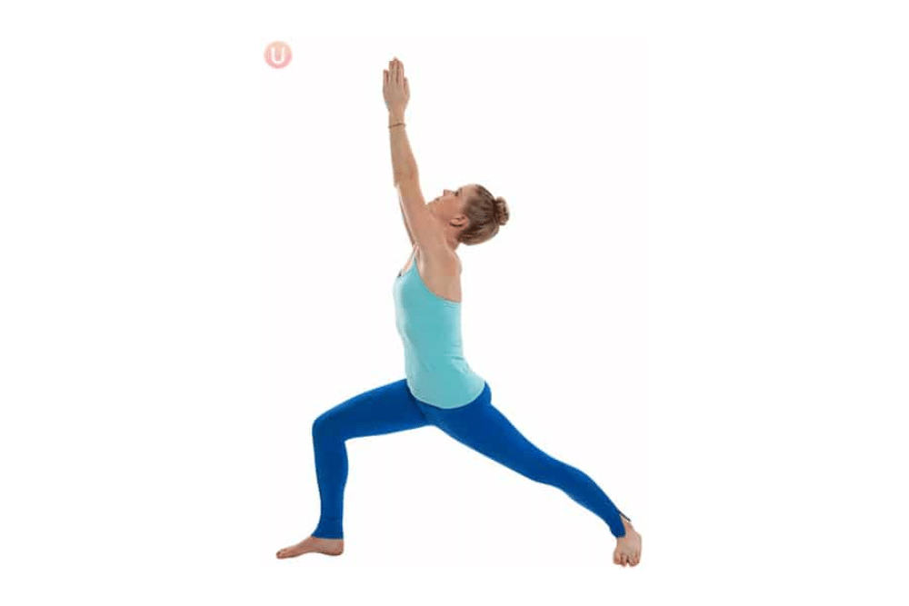 Chloe Freytag demonstrating a warrior 1 yoga pose.
