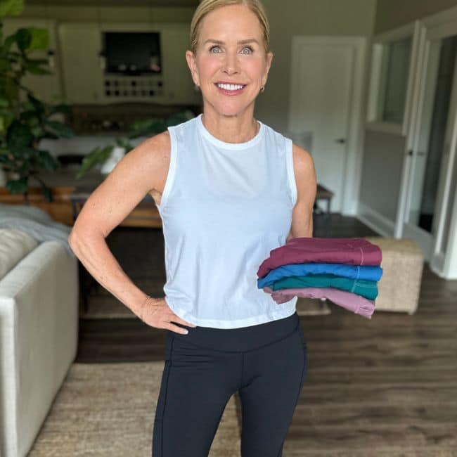 chris freytag fitness expert holding best leggings on amazon in different colors