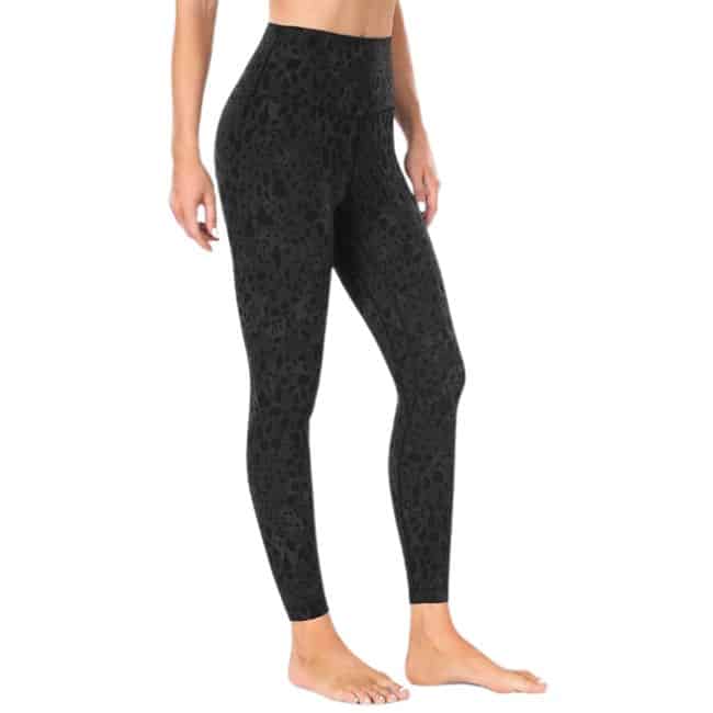 bottom half of woman wearing dark animal print leggings