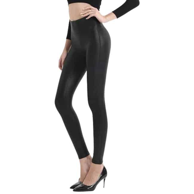 bottom half of woman wearing black faux leather leggings with black heels