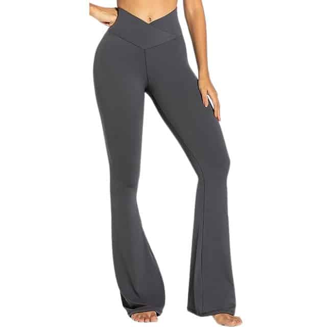 bottom half of woman wearing dark grey flare leggings with crossover v waist band