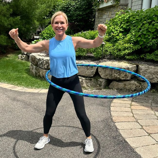 chris freytag showing favorite weighted hula hoop outdoors
