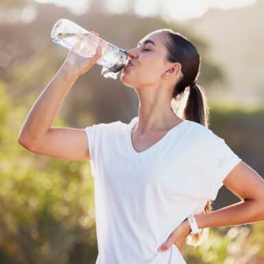 woman drinking water bottle