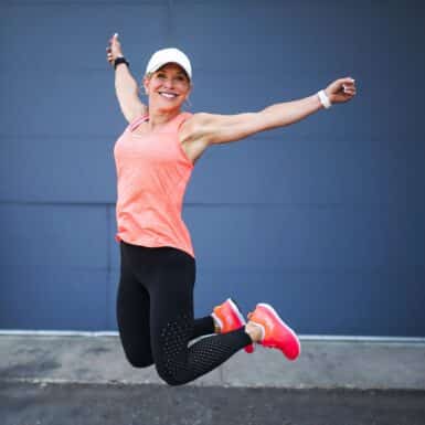 chris freytag jumping in air happy with strategies to get rid of menopause belly fat