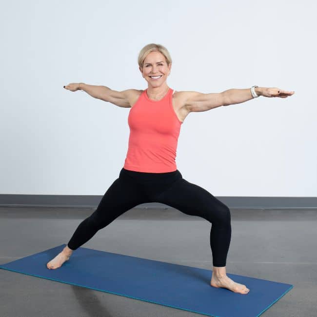 chris freytag fitness expert doing yoga to reduce menopause belly fat