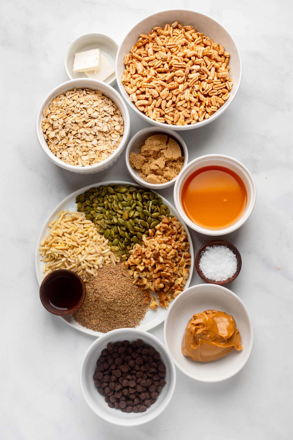 raw ingredients in bowls ready to make healthy protein bar recipe