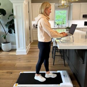 chris freytag using walking pad in kitchen