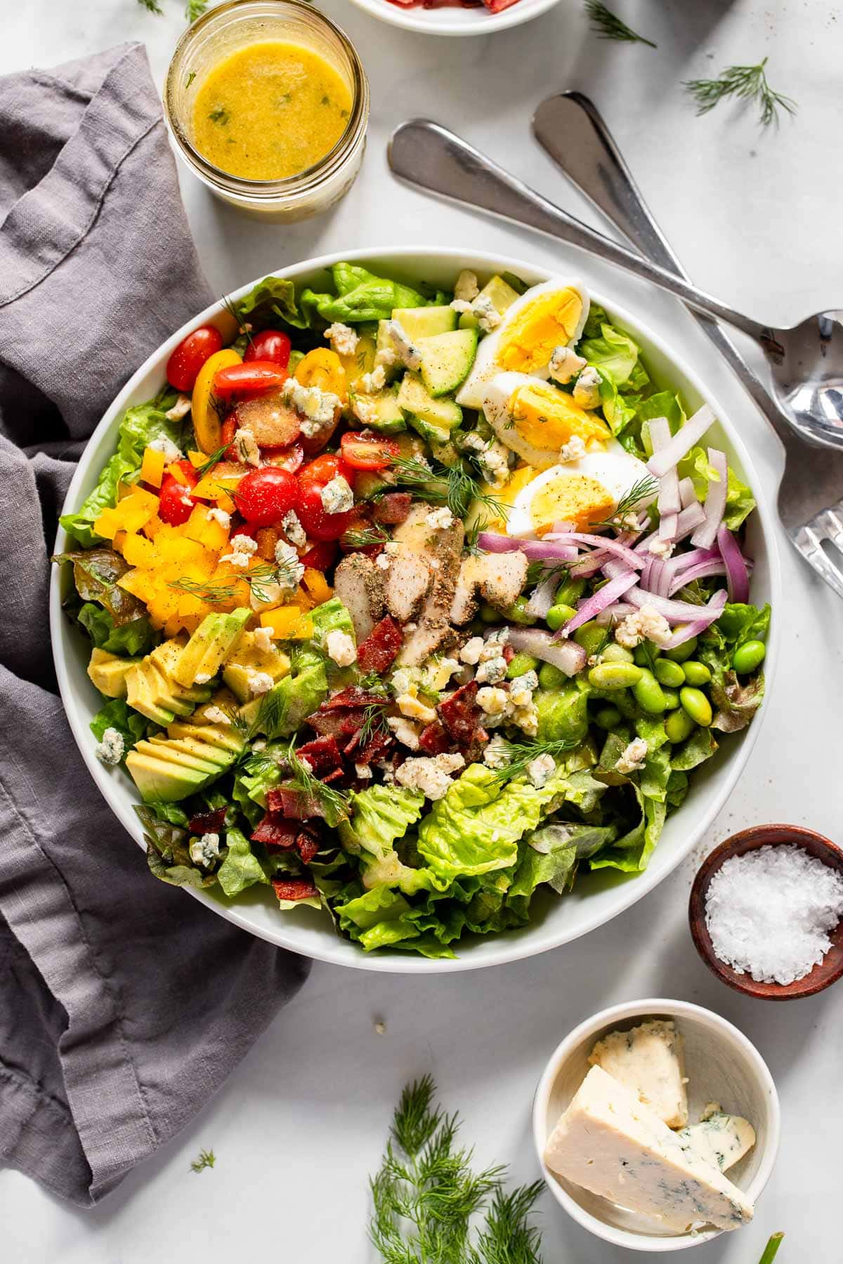 stunning healthy cobb salad prepared with dressing on the side