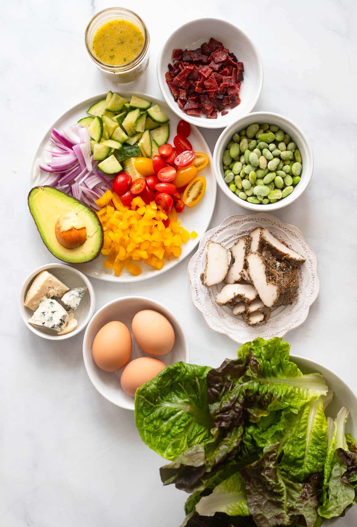 overhead view of raw ingredients ready to make healthier cobb salad