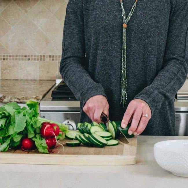 chris freytag chopping fresh vegetables in kitchen