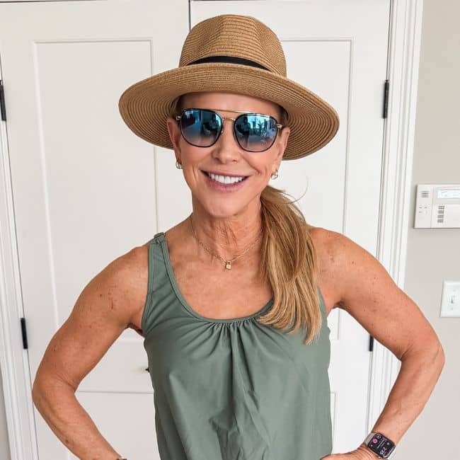 woman wearing wide brim hat for sun protection