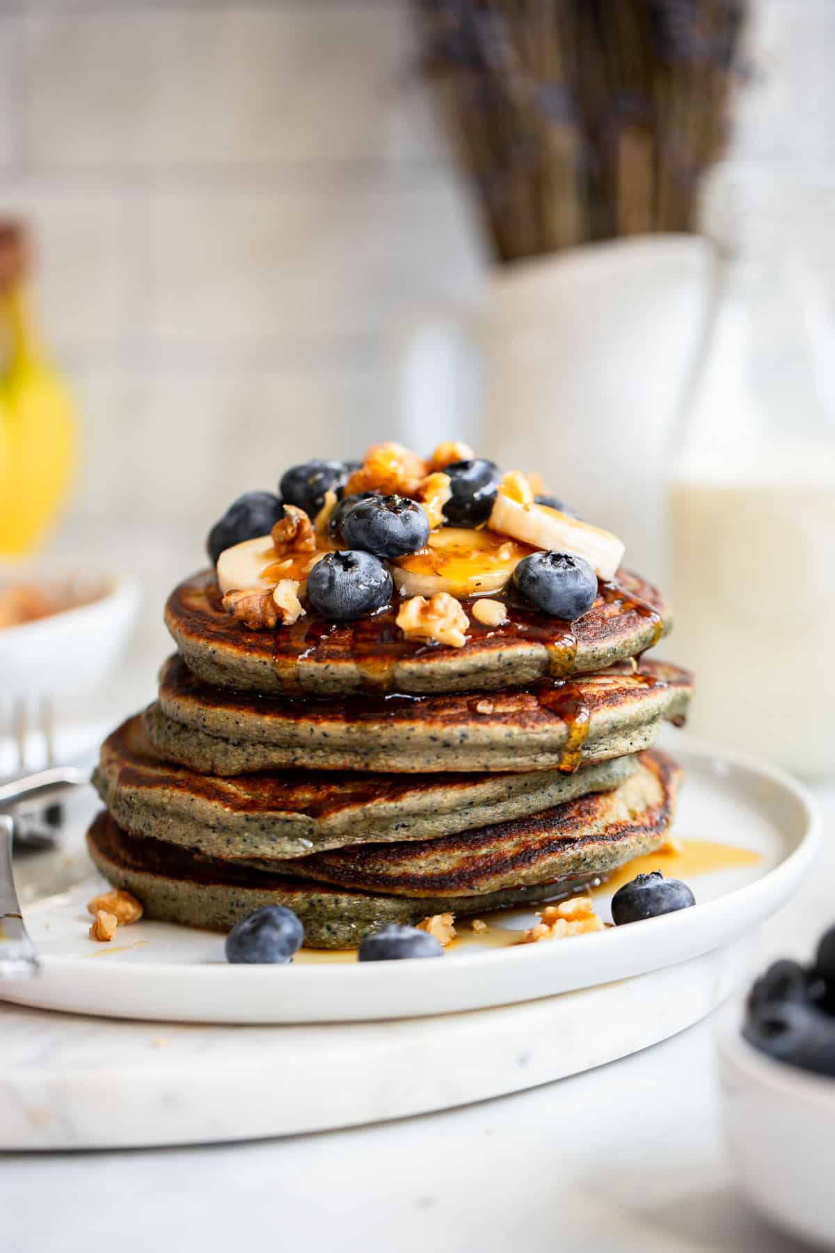 prepared stack of protein pancakes with toppings