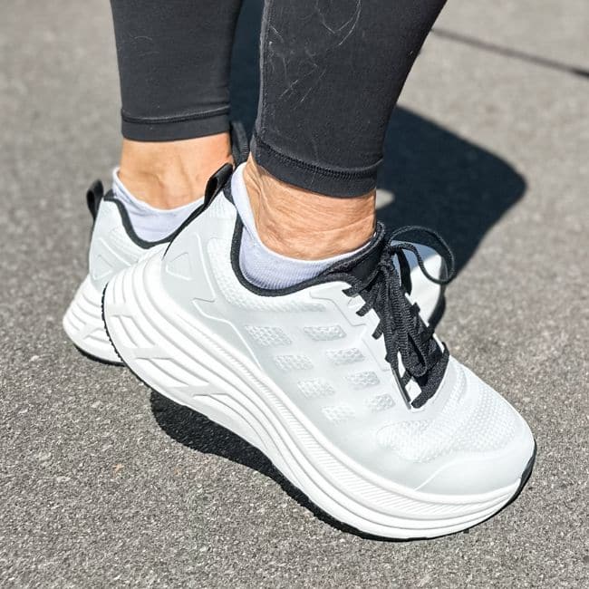 Close-up of woman wearing hoka lookalikes from Amazon