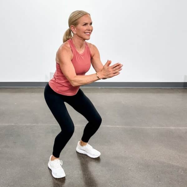 woman showing which muscle groups to workout together