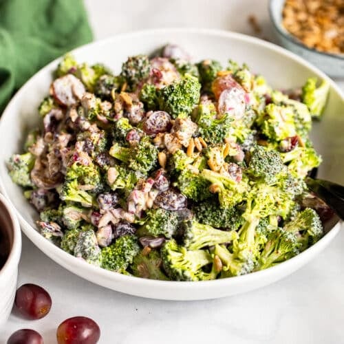 healthy broccoli salad served in white bowl