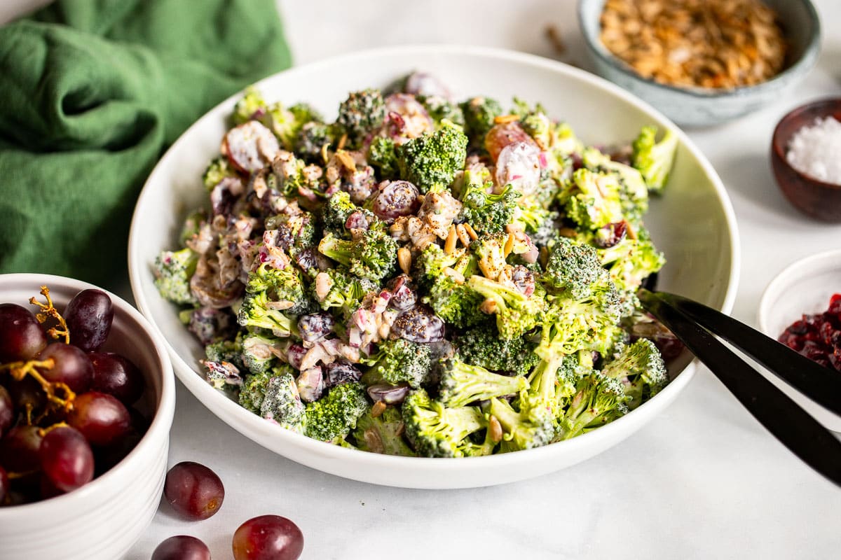 healthy broccoli salad served in white bowl