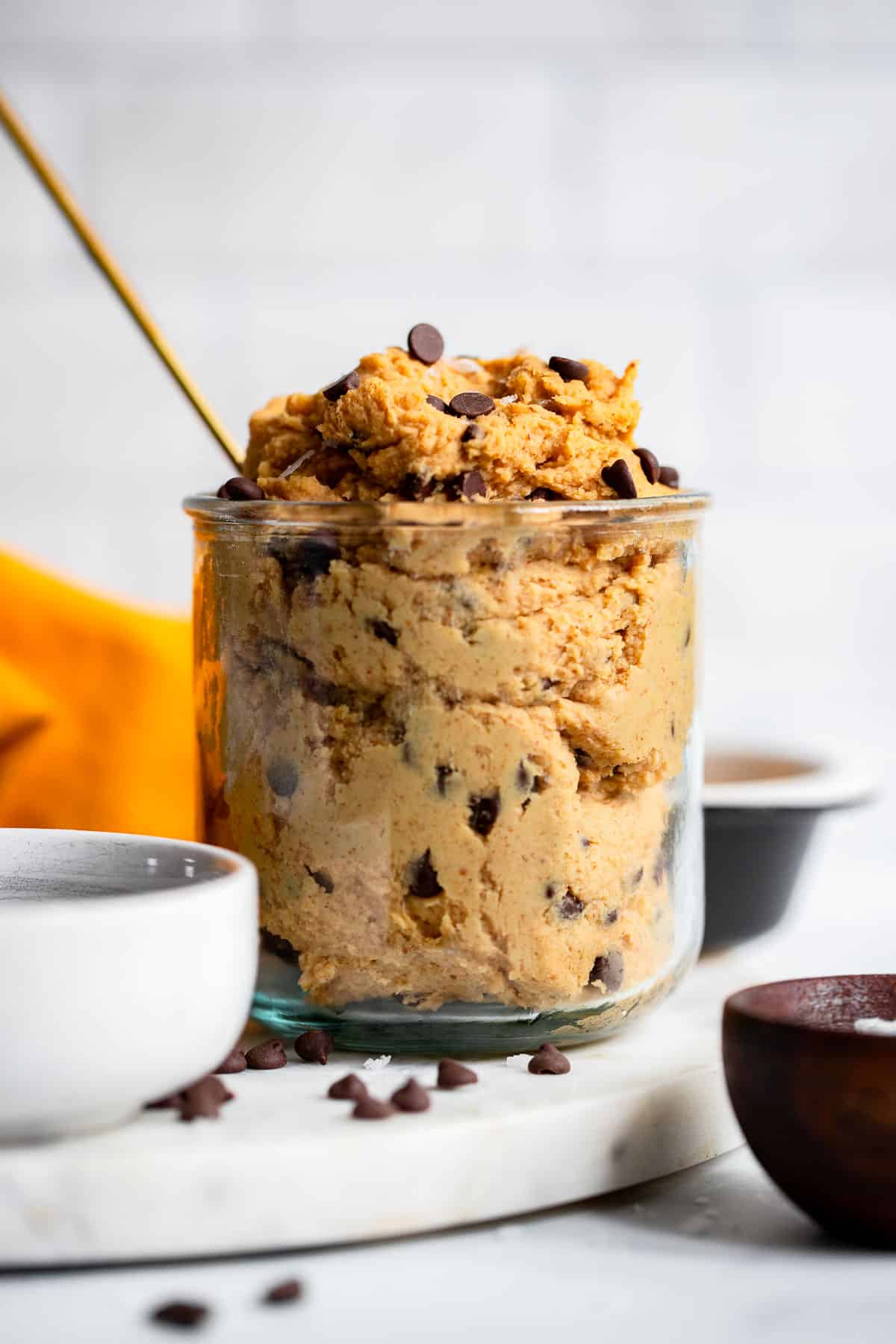 healthy cookie dough dip served in glass bowl