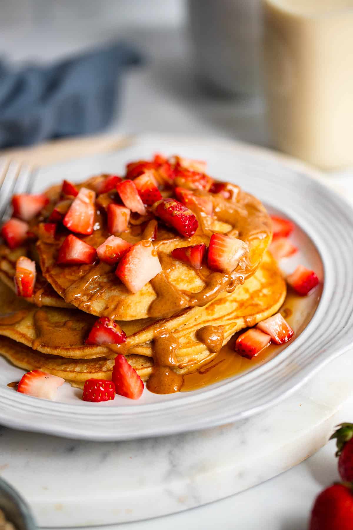 3 ingredient pancakes with drizzle and strawberry toppings