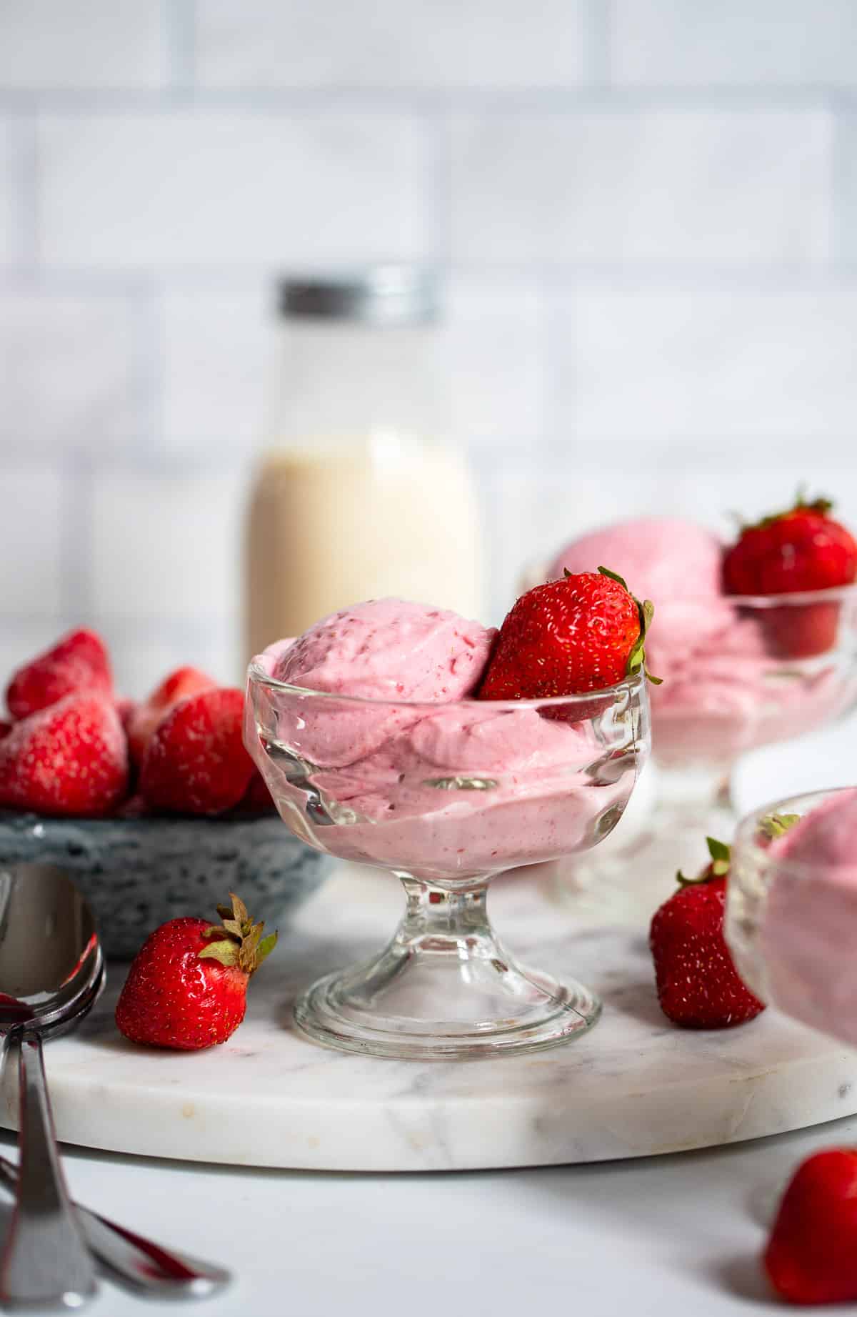 strawberry cottage cheese ice cream in glass bowls