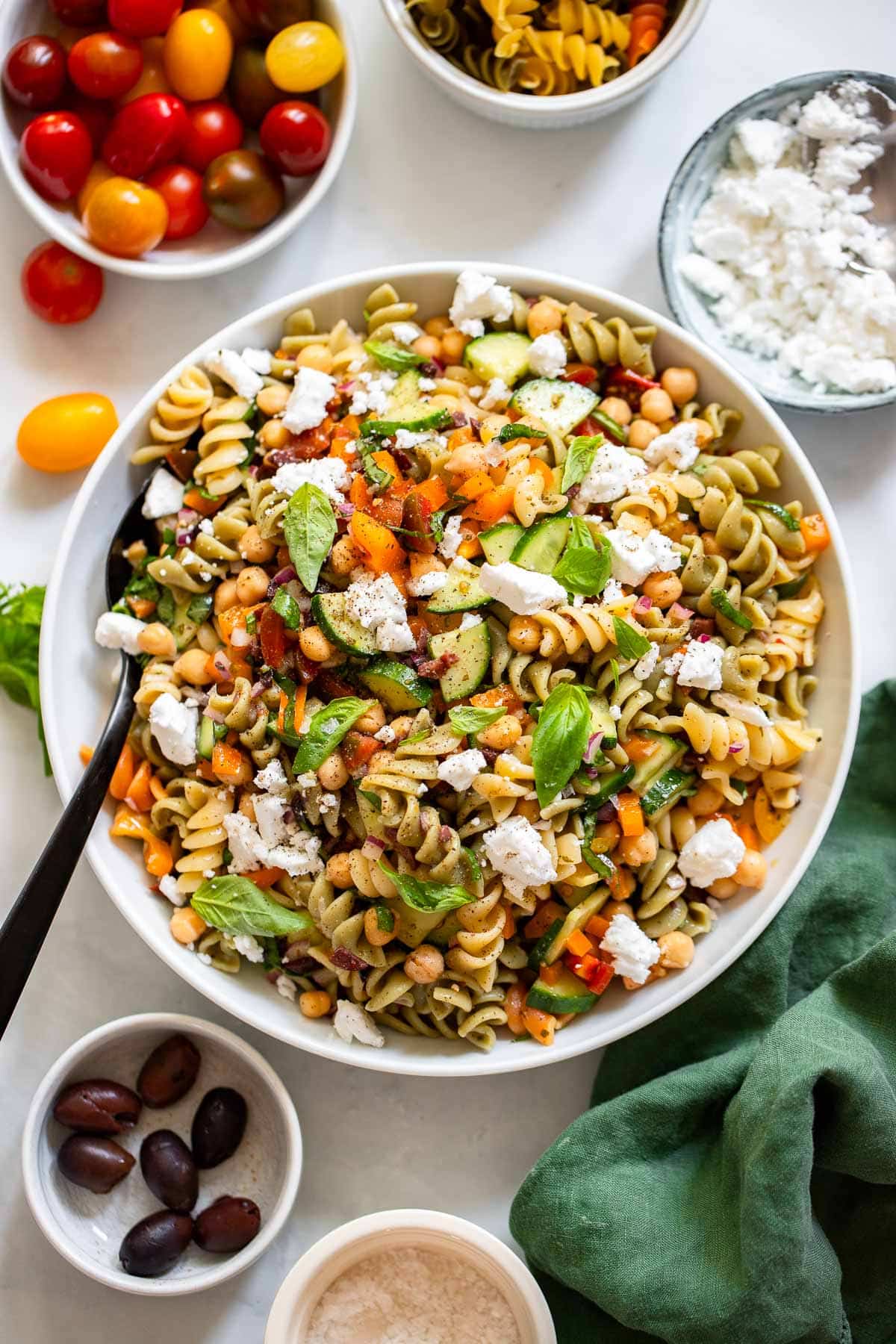 healthy pasta salad prepared in bowl on white counter