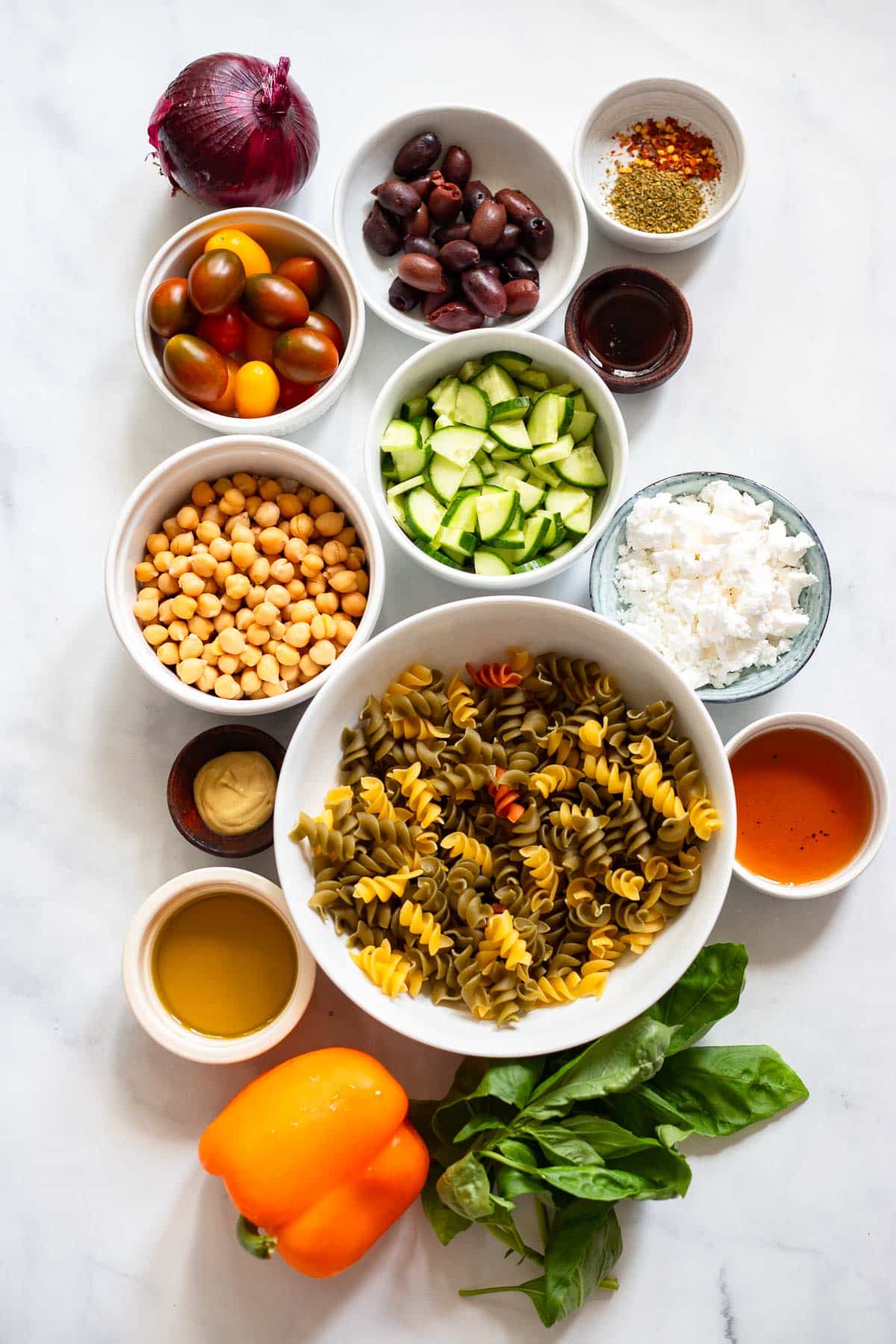 raw ingredients for healthy pasta salad on counter