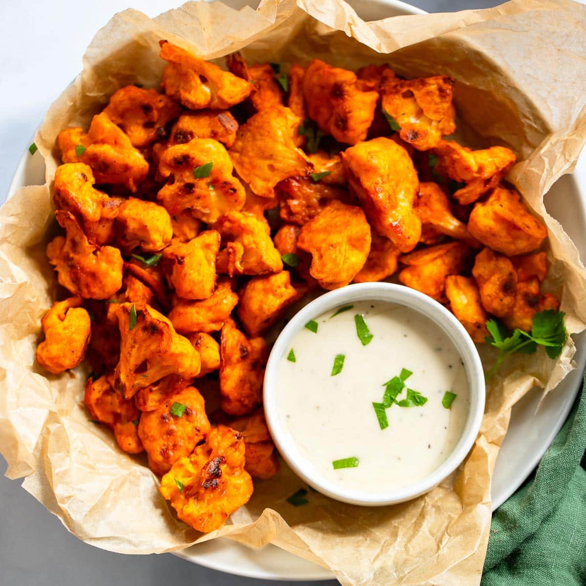 prepared buffalo cauliflower bites in dish with sauce